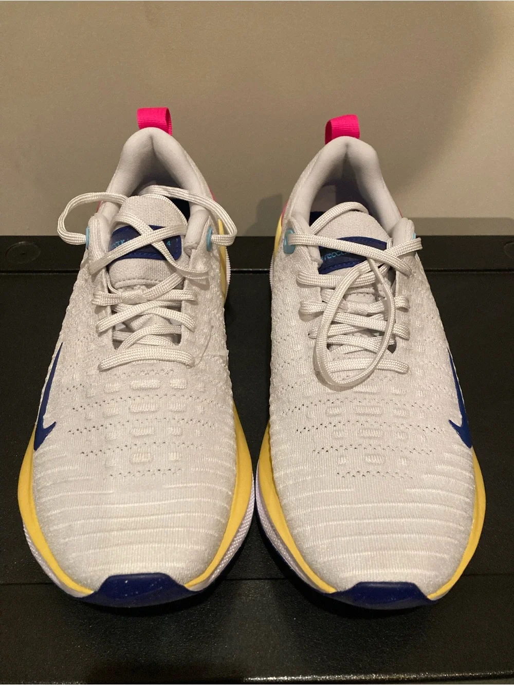 Nike White Athletic Shoes with Blue Swoosh and Yellow Midsole
